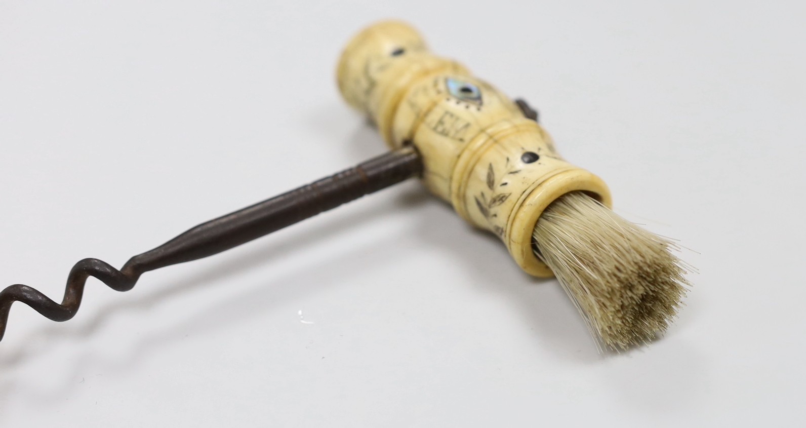 A 19th century carved bone handled cork screw, dated 1842